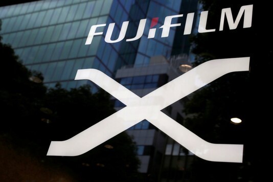 FILE PHOTO - Fujifilm's company logo (top) is seen at its exhibition hall nearby the headquarters of Fujifilm Holdings Corp in Tokyo, Japan June 12, 2017. REUTERS/Kim Kyung-Hoon/File Photo