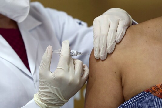 Nurse Isabelli Guasso administers potential vaccine for the coronavirus disease (COVID-19), to volunteer. (Reuters)