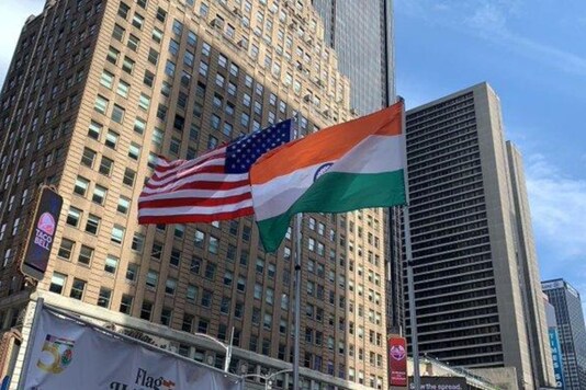 Randhir Jaiswal, Consul General of India in New York, hoists Indian national flag at the Times Square at an event organised by Federation of Indian Associations. (ANI)