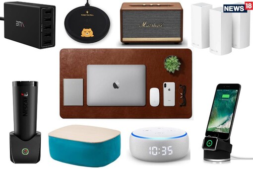 Clockwise from top right: Linksys Velop Mesh Wi-Fi System, Halo Apple iPhone and Watch Stand, Amazon Echo Dot with Clock, Modern Art Lap Cushion Desk, É by Nescafé smart coffee mug, AMX XP50 charging hub, Belkin Kakao Friends wireless charger, Marshall Acton II and Daily Objects Turf Vegan Leather Desk Mat (centre)