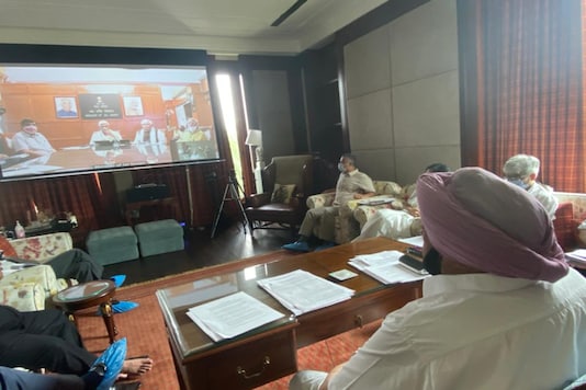 Punjab CM Amarinder Singh attends a virtual meeting with his Haryana counterpart ML Khattar  and Union minister Gajendra Singh Shekhawat on Tuesday. (Twitter/Punjab CMO)