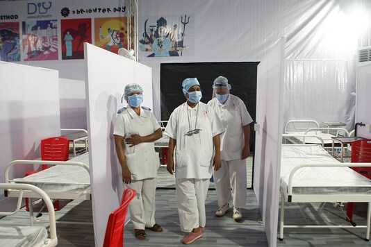 Nurses wearing protective masks stand inside a temporary facility created to facilitate cancer patients diagnosed with coronavirus disease (COVID-19) in Mumbai. (Reuters)