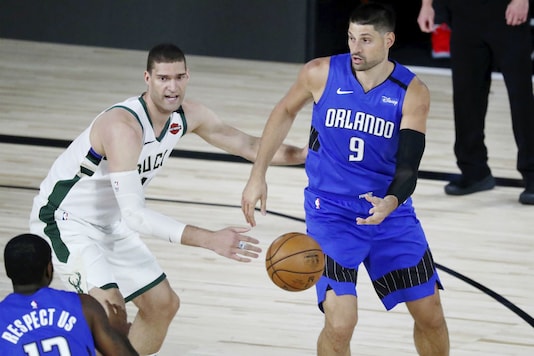 Nikola Vucevic (R) makes a pass. (Image: AP) Nikola Vucevic (R) makes a pass. (Image: AP)