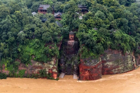 Flood Waters Reach the Toes of China's Famous Giant Buddha Statue ...