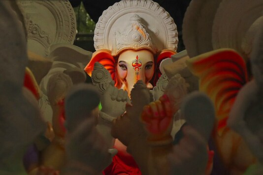 An idol of elephant-headed Hindu god Ganesha stands at a workshop ahead of the Ganesh Chaturthi festival in Hyderabad, India, Wednesday, Aug. 12, 2020. The festival is celebrated to mark the birth of Lord Ganesha who is widely worshiped by Hindus as the god of wisdom, prosperity and good fortune. (AP Photo/Mahesh Kumar A.)