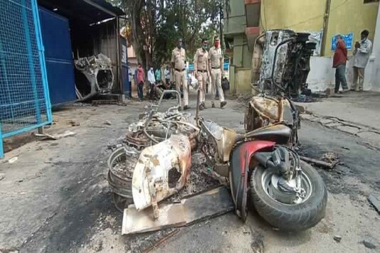 Two-wheelers that were set on fire by the mob in Bengaluru. (Image: Sudhakar/News18)