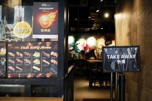 A take-away sign is pictured outside a restaurant after the government banned dine-in services, following the coronavirus disease (COVID-19) outbreak in Hong Kong, China. (Image: Reuters)
