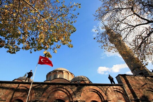 FILE PHOTO: Turkish police officers stand guard atop the Kariye (Chora) museum, the 11th century church of St. Savior, during a visit by Britain's Prince Charles and his wife Camilla in Istanbul, November 28, 2007. REUTERS/Fatih Saribas
