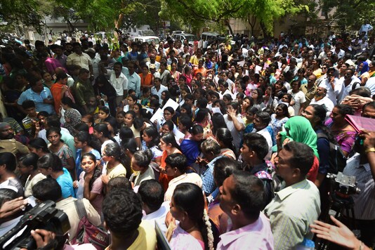 In this May 5, 2019 file photo, candidates wait outside an examination centre to appear in the National Eligibility-Cum-Entrance Test (NEET) exams in Chennai. (PTI)