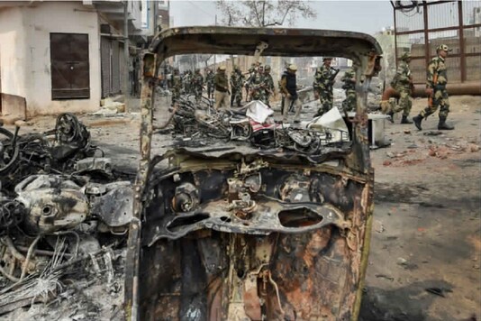 File photo. Security personnel were seen walking past Bhagirathi Vihar in northeast Delhi after the riots. (PTI)