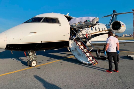 In this photo provided by Alexei Navalny's press team, on August 22, 2020, medics upload Alexei Navalny into a German special medical plane at an airport in Omsk, Russia. (Kira Yarmysh/Alexei Navalny's press team via AP)