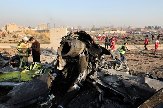 FILE - In this Jan. 8, 2020, file photo, debris at the scene where a Ukrainian plane crashed in Shahedshahr southwest of the capital Tehran, Iran. (AP Photo/Ebrahim Noroozi, File)