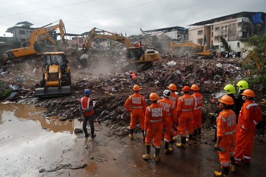 Rescue workers search for survivors in the debris after a five-story building collapsed in Mahad in Raigad district in  Maharashtra, August 25, 2020. REUTERS/Francis Mascarenhas
