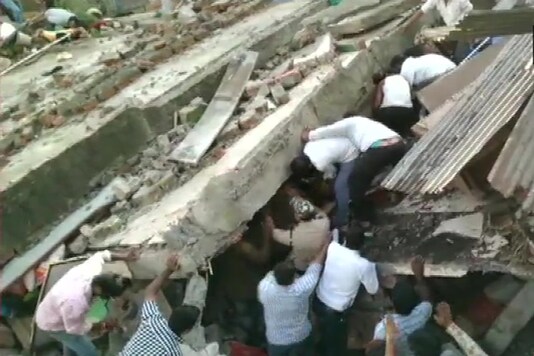 A two-storey building collapsed near Lal Gate area in Dewas on Tuesday. (Image: Twitter/ANI)