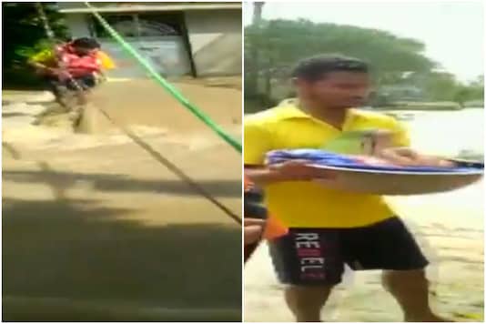 The video showed the personnel clinging by rope as they rescued people. 
