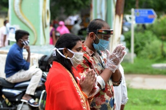 Devotees offer prayers on the occasion of Naga Panchami in Hyderabad. (AFP)