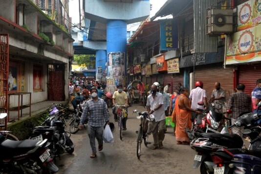 A file photo shows people walking in a market during lockdown in Siliguri. (AFP)