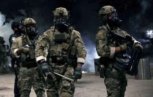 Portland police use tear gas after declaring riot for second night