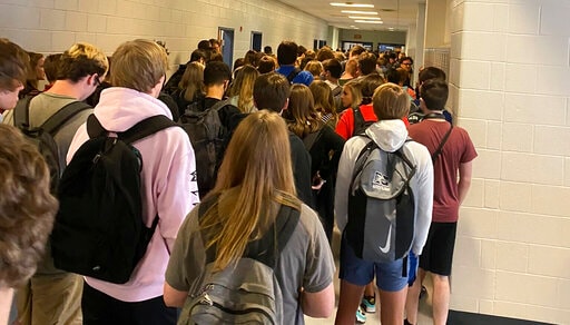 Georgia school with large crowds reports positive cases