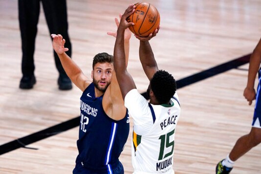 Short-handed Mavericks use huge rally to beat Jazz 122-114