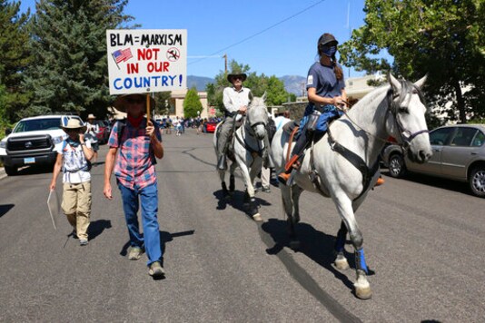 Protesters met with jeers by crowd with guns in Nevada city