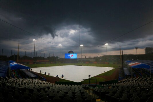 Rays-Jays halted by rain; finish Sunday, then 7-inning game
