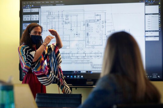 Taller cubicles, one-way aisles: Office workers must adjust