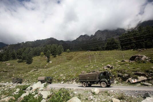 An Indian Army convoy moves on the Srinagar- Ladakh highway at Gagangeer, northeast of Srinagar, on Tuesday. (AP)