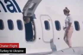 Watch: Woman Walks on Aircraft Wing after Feeling ‘Too Hot’ in Ukraine