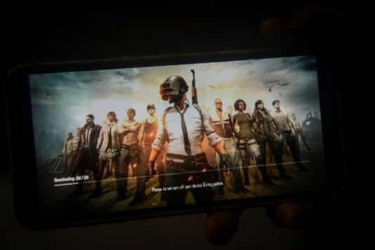 A girl holds her smartphone as she updates PUBG in Siliguri. (AFP)