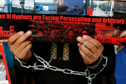 A Chinese Uyghur Muslim participates in an anti-China protest. (Reuters/Jorge Silva)
