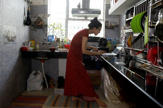  A marketing and branding specialist works from her home after her office was closed due to a 21-day nationwide lockdown to slow the spreading of the coronavirus disease (COVID-19), in New Delhi. (Reuters)