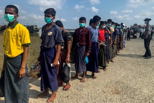 A file photo shows released Rohingya prisoners arrive in Sittwe jetty in Rakhine State after being transported by military boat. (AFP)