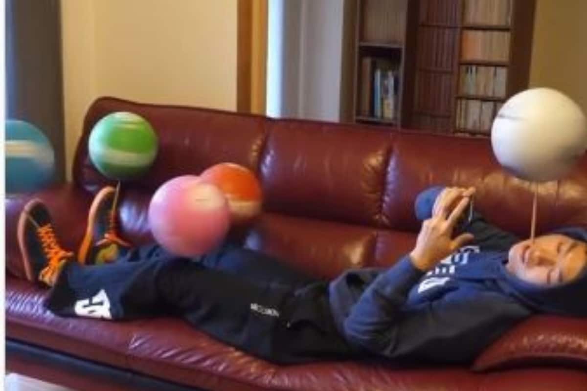 WATCH: Man Spins Five Footballs at a Time from the Comfort of His Couch