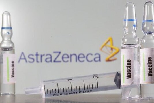A test tube labelled with the Vaccine is seen in front of AstraZeneca logo in this illustration. (Reuters)