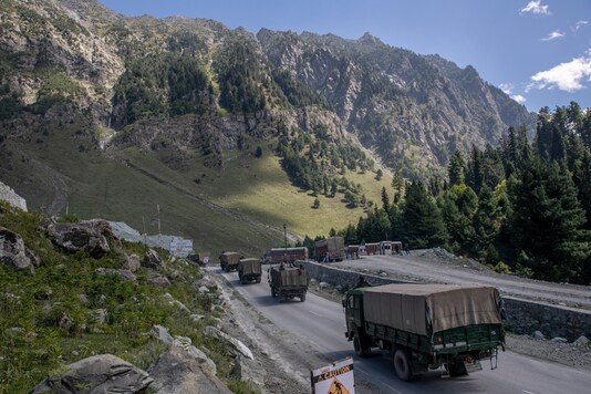 An Indian army convoy moves on the Srinagar-Ladakh highway in Gagangeer, northeast of Srinagar, on September 9, 2020. (AP Photo / Dar Yasin)