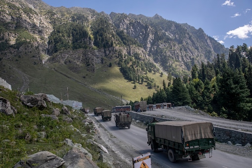 An Indian army convoy moves on the Srinagar-Ladakh highway at Gagangeer, northeast of Srinagar, on September 9, 2020. (AP Photo/ Dar Yasin)
