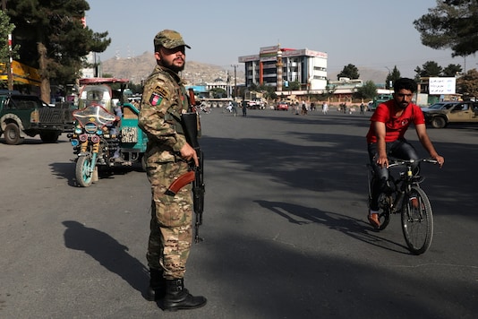 File photo of an Afghan policeman standing guard at a check point in Kabul, Afghanistan. (Credit: REUTERS)