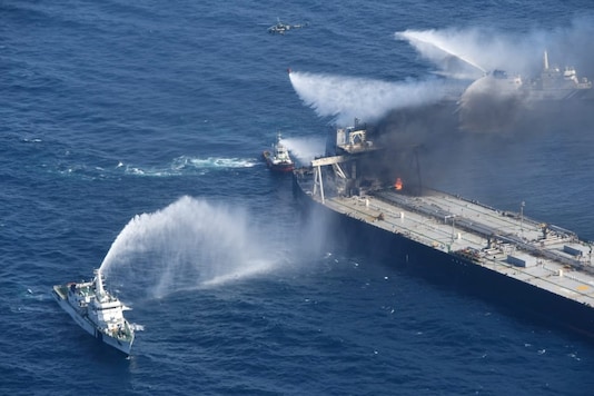 A Sri Lankan Navy boat sprays water on the New Diamond, that was carrying the equivalent of about 2 million barrels of oil, after a fire broke out off the east coast of Sri Lanka last week. (Credit: REUTERS) A Sri Lankan Navy boat sprays water on the New Diamond, that was carrying the equivalent of about 2 million barrels of oil, after a fire broke out off the east coast of Sri Lanka last week. (Credit: REUTERS)