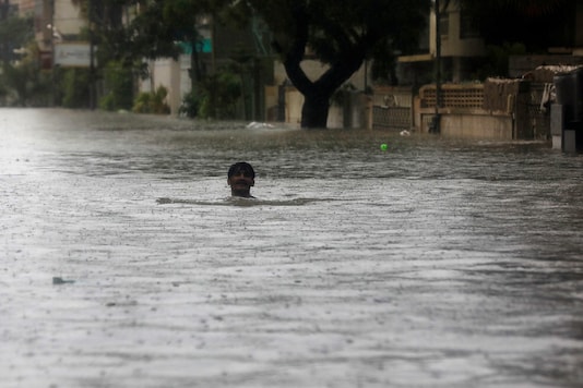 File photo of a man wading through the flooded street during monsoon rain, as the outbreak of the coronavirus disease (COVID-19) continues, in Karachi, Pakistan.(Credit: REUTERS) File photo of a man wading through the flooded street during monsoon rain, as the outbreak of the coronavirus disease (COVID-19) continues, in Karachi, Pakistan.(Credit: REUTERS)
