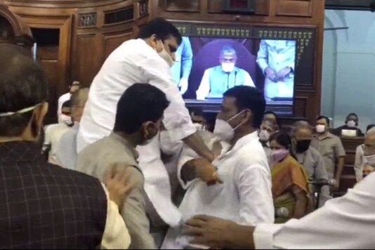 Sanjay Singh being carried away by marshals