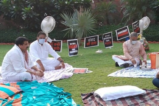 RS Deputy Chairman Harivansh offers tea to the suspended MPs after their overnight sit-in.
