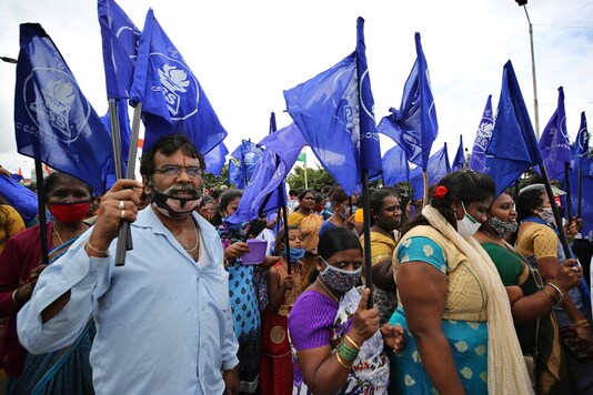 Farmers participate in an anti-government protest against farm bills in Bengaluru, India, Monday. (Image: AP)