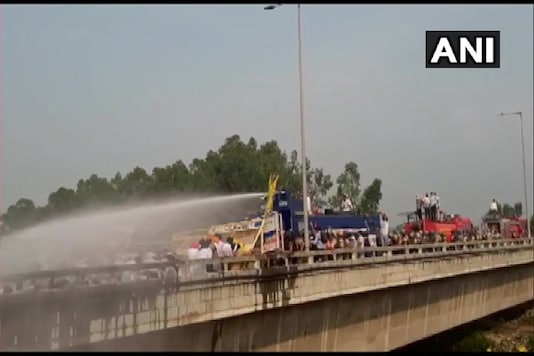 Haryana Police use water cannon to disperse Lok Insaf Party workers protesting against farm bills. (Picture credit: ANI Twitter)