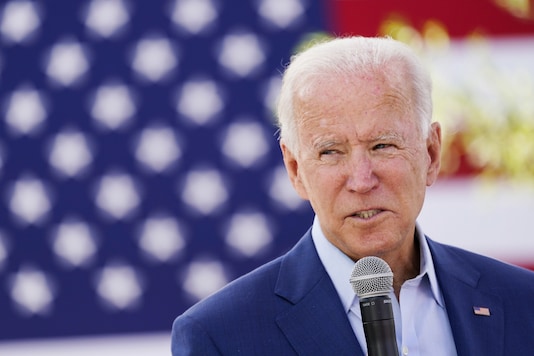 Democratic US presidential nominee Joe Biden speaks to attendees at an outdoor 