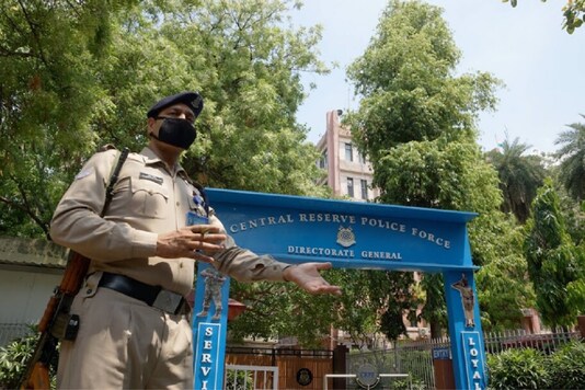 A CRPF jawan stands guard outside the force's headquarters (Photo Credit: PTI) A CRPF jawan stands guard outside the force's headquarters (Photo Credit: PTI)