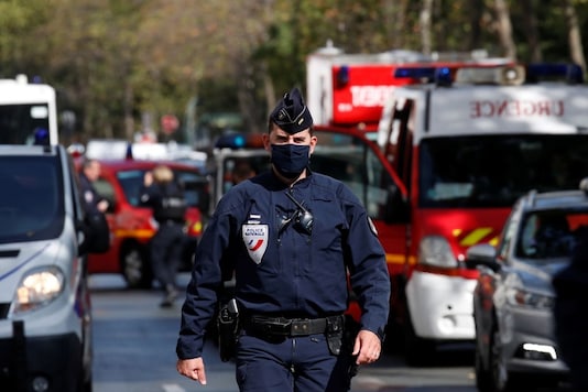 A police officer is seen at the scene of an incident near the former offices of French magazine Charlie Hebdo, in Paris, France September 25, 2020. REUTERS/Gonzalo Fuentes
