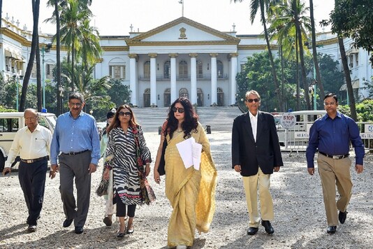 Fashion designer-turned-BJP leader Agnimitra Paul (C) with other members leave the Governor House in Kolkata. (PTI Photo)