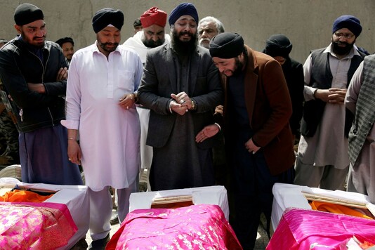 Afghan Sikh men mourn their beloved ones during a funeral procession for those who were killed on Wednesday by a lone Islamic State gunman, rampaged through a Sikh house of worship, in Kabul, Afghanistan. Afghanistan’s dwindling community of Sikhs and Hindus is shrinking to its lowest levels. With growing threats from the local Islamic State affiliate, many are choosing to leave the country of their birth to escape the insecurity and a once-thriving community of as many as 250,000 members now counts fewer than 700.  (AP Photo/Tamana Sarwary, File)