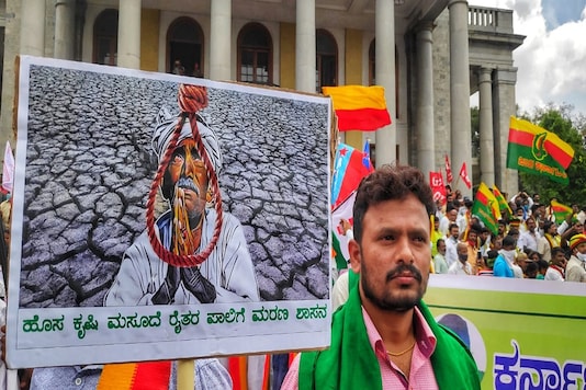 Farmers protest against the new central and state farm related laws in Bengaluru on Monday. (Photo: PTI)